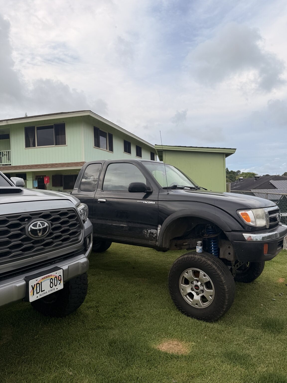 Two Toyota trucks parked together