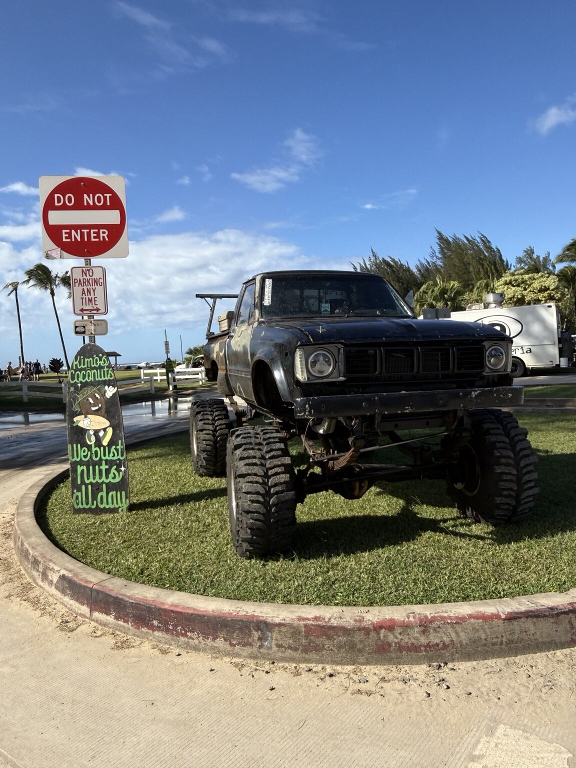 Lifted black Toyota truck near the coast